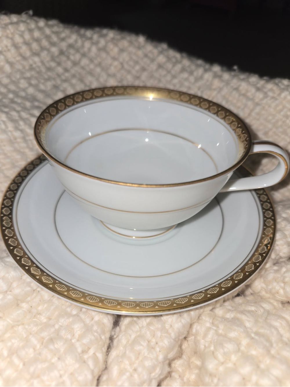 Noritake White Porcelain Teacup and Saucer with Gold Trim